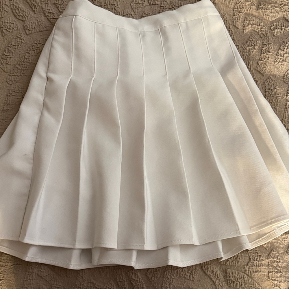 Elegant White Pleated Skirt with shirts underneath